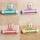 ABS Rolling Squeezer Toothpaste Dispenser Tube Partner Sucker Hanging Holder