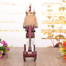 Maroon Wooden Nutcracker On A Rocking Horse