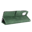 For Samsung Galaxy A12 / M12 / F12 Solid Color Skin Feel Magnetic Buckle Horizontal Flip Calf Texture PU Leather Case with Holder & Card Slots & Wallet(Green)