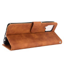 For Samsung Galaxy A12 / M12 / F12 Solid Color Skin Feel Magnetic Buckle Horizontal Flip Calf Texture PU Leather Case with Holder & Card Slots & Wallet(Brown)