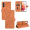 For Samsung Galaxy S21 FE Solid Color Skin Feel Magnetic Buckle Horizontal Flip Calf Texture PU Leather Case with Holder & Card Slots & Wallet(Brown)