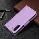 For Samsung Galaxy S21 FE Embossing Two Butterflies Pattern Horizontal Flip PU Leather Case with Holder & Card Slot & Wallet & Lanyard(Purple)