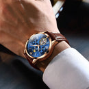 OLEVS 9912 Hollow Flywheel Week Calendar Dial Luminous Mechanical Watch for Men(Rose Gold Shell Black Surface)