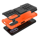 For Motorola Moto G62 5G Tire Texture TPU + PC Phone Case with Holder(Orange)