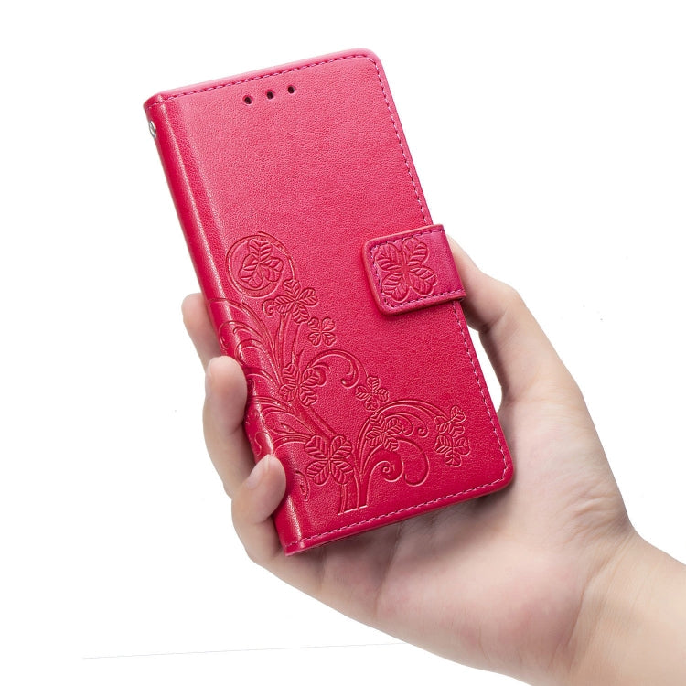 For Samsung Galaxy A21s Four-leaf Clasp Embossed Buckle Mobile Phone Protection Leather Case with Lanyard & Card Slot & Wallet & Bracket Function(Magenta)