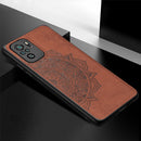 For Xiaomi Redmi Note10 4G Mandala Embossed Cloth Cover PC + TPU Mobile Phone Case with Magnetic Function and Hand Strap(Brown)