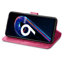For OPPO Realme 9 Pro Four-leaf Clasp Embossed Buckle Leather Phone Case(Magenta)