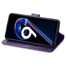 For OPPO Realme 9 Pro Four-leaf Clasp Embossed Buckle Leather Phone Case(Purple)